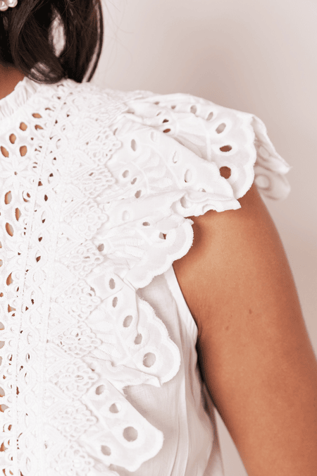 Blouse with perforated lace